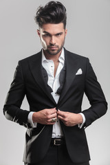 Portrait of an elegant young man looking at the camera