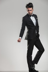 elegant young man snapping his finger