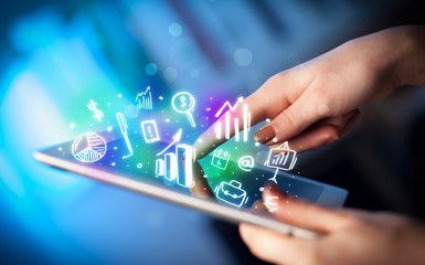 Hand touching tablet pc, charts concept