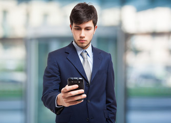 Young businessman using a mobile phone