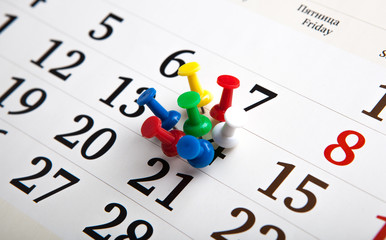 large wall calendar with needles