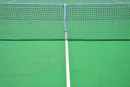 tennis net in green court