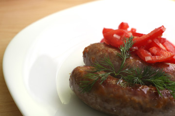 Grilled sausages and salad