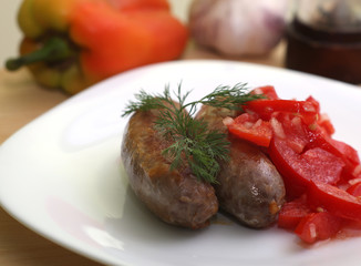 Sausages and tomato salad