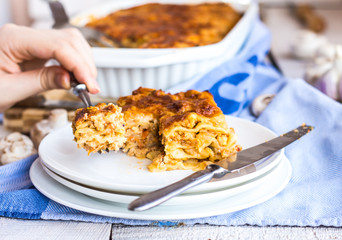processes food meat lasagna, hands, Italian food
