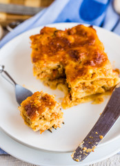 processes food meat lasagna on a white bowl, .Italian food