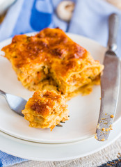 processes food meat lasagna on a white bowl, .Italian food
