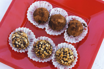 Chocolate truffles in a red tray
