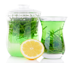 Estragon drink with lemon isolated on white