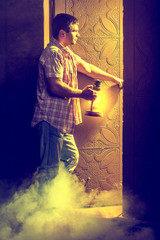 man before doorway of light