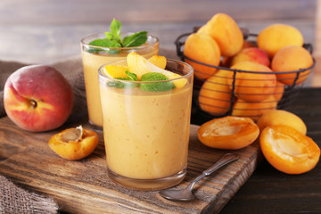 Apricot dessert in glasses on table close-up