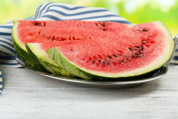 Fresh slice of watermelon on table outdoors, close up