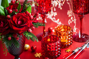 Christmas table decoration with flowers and candles