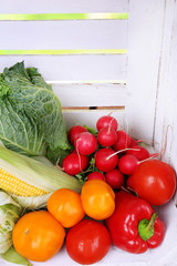 Vegetables on white wooden box background