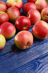 Sweet apples on wooden background