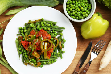 Healthy salad with peas, asparagus and pepper, close-up