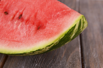 Slice of watermelon on wooden table