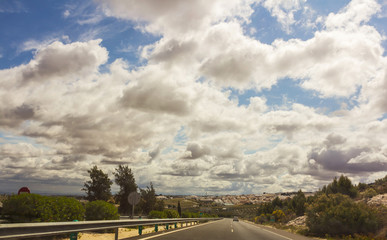 Clouds above road
