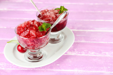 Closeup of cherry granita in glass bowls,