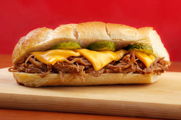 Pulled pork baguette sandwich with cheese - 70811603