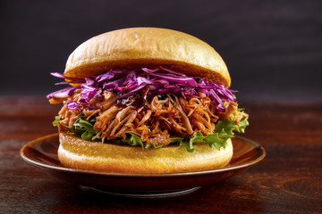 Pulled pork burger with red cabbage salad on plate - 70811610