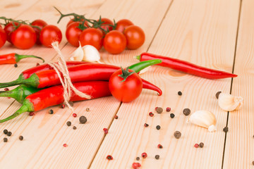 Hot chili pepper on wooden texture.