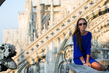 Beautiful woman on on the rooftop of Duomo, Milan, Italy