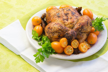 Roast chicken with  Sweet kumquat citrus fruits and parsley