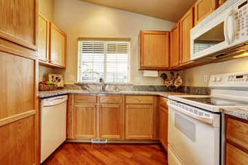 Small kitchen area with white appliances