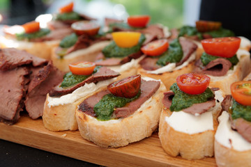 Bruschettas with beefsteak and pesto sauce