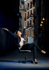 Young Happy Business woman on Office Chair on Street