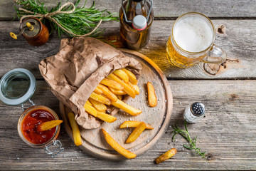 Fresh french fries served with beer
