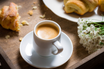 Breakfast to bed with hot coffee and a croissant