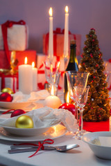 White and red decorations on the Christmas table