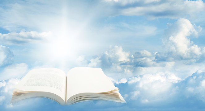 Open book in heavenly sky