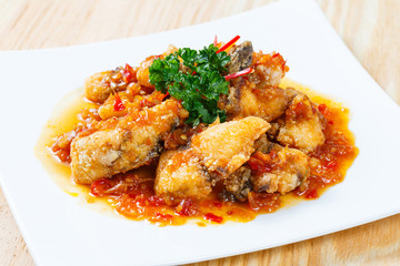 Deep fried grouper fish spicy sweet and sour sauce