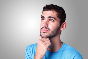 Obraz premium young handsome man think