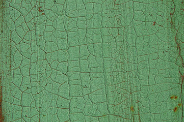 Cracked paint on metal surface