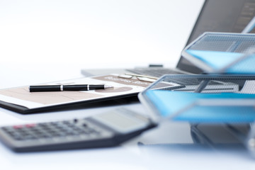 Analyzing investment charts with laptop. Accounting