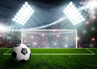 Soccer ball on green stadium arena