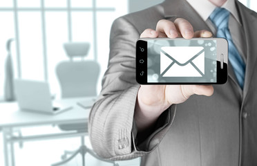 A man holding smartphone with one new message on a screen