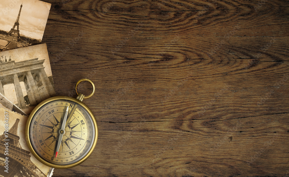 Poster Adventure concept, old pictures and compass on wooden table