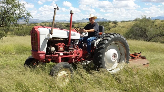 Mowing Arizona grasslands with the old tractor and brushhog