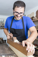 luthier working in his workshop