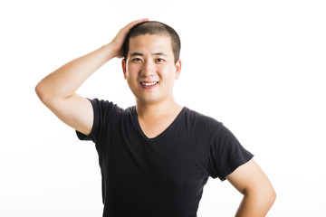 Young asian man standing isolated on white