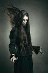 Studio portrait of woman wearing Gothic clothes