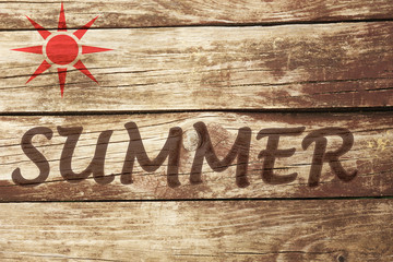 Summer  concept. Inscription on wooden wall background