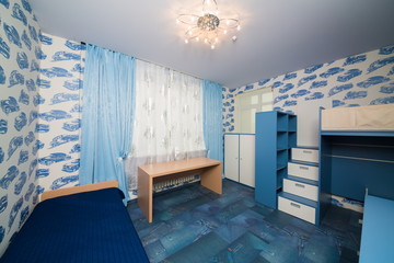 modern childrens bedroom with fun wallpapers.