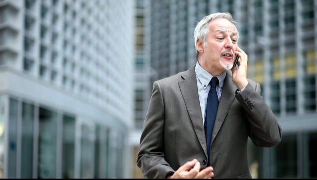 Businessman changing his bad mood when meeting a colleague