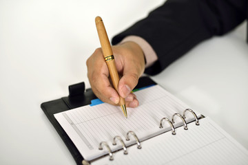 Business Man Writing On Agenda
